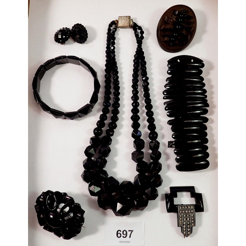 697 - A collection of Victorian Whitby jet jewellery including brooches and necklace