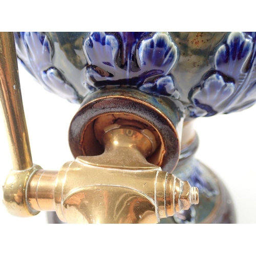 7 - A Doulton Lambeth stoneware water filter with blue floral decoration, brass tap, 36cm tall