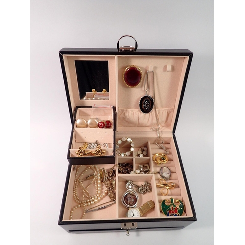 711 - A leather clad jewellery box and contents of costume jewellery