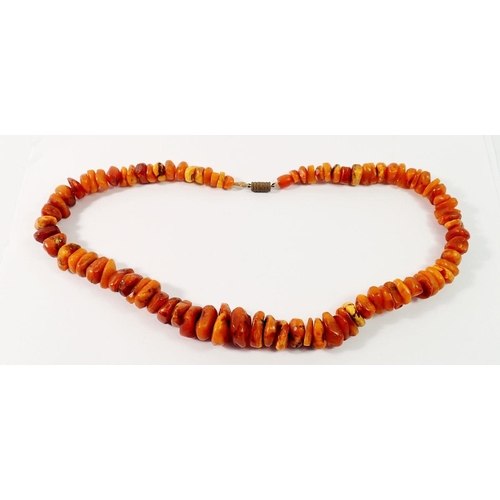 716 - An amber chip necklace, 52cm long, 70g