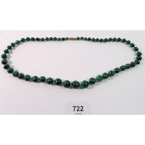 722 - A malachite bead necklace, 55cm