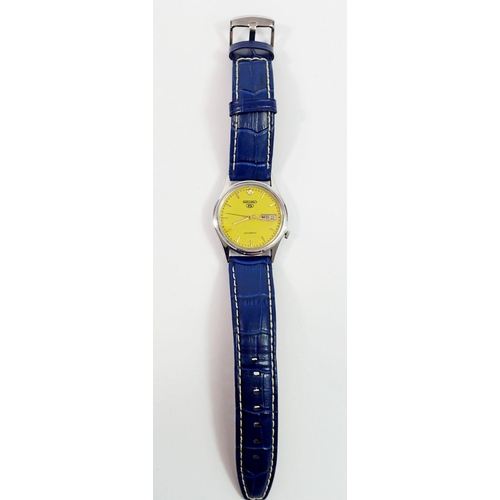 735 - A Seiko 5 gents automatic wristwatch with yellow dial and blue leather strap