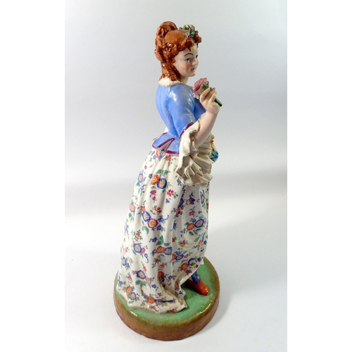 78 - A 19th century French porcelain large figure of a woman with flowers, 44cm tall