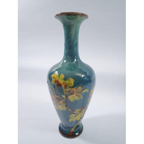 8 - A Doulton Impasto vase painted oak leaves, 28cm tall by Lizzie Haughton