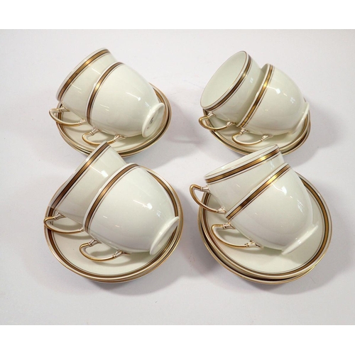 89 - A Paragon set of eight gilt and white tea cups and nine saucers