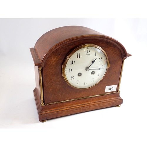 900 - An oak 1920's mantel clock with enamel dial, 24cm tall