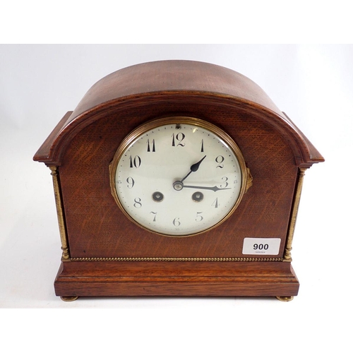 900 - An oak 1920's mantel clock with enamel dial, 24cm tall