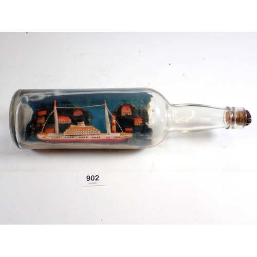 902 - An antique ship in a bottle, 30cm