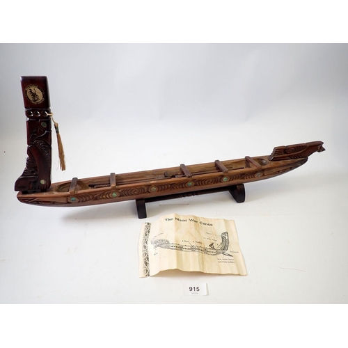 915 - A carved Maori War canoe from New Zealand, 64cm long