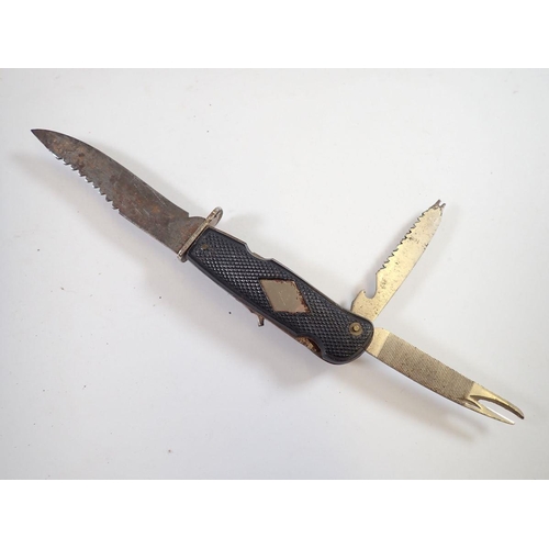 944 - A Solingen small serrated knife, an Egyptian decorative knife and a horn handled knife