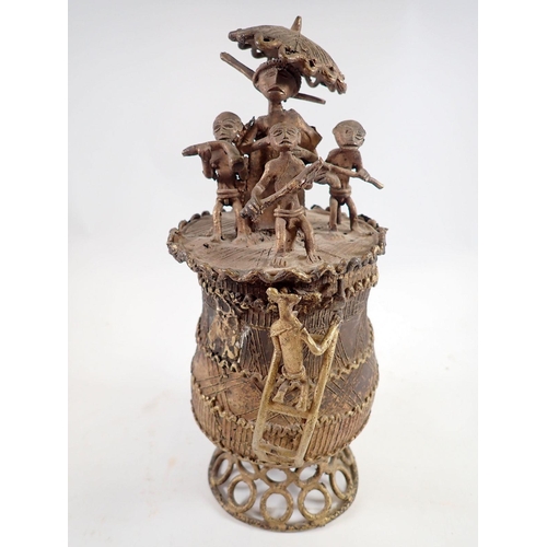 955 - An early to mid 20th century Ashanti/Akan gold dust lidded lost wax bronze urn decorated with incise... 