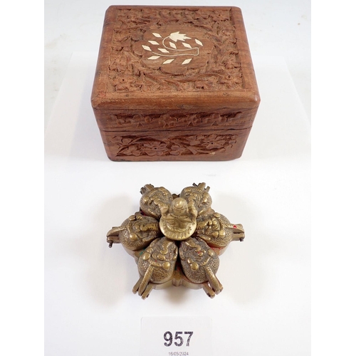 957 - An Indian brass Kumkum Hindu spice box and a carved wooden box