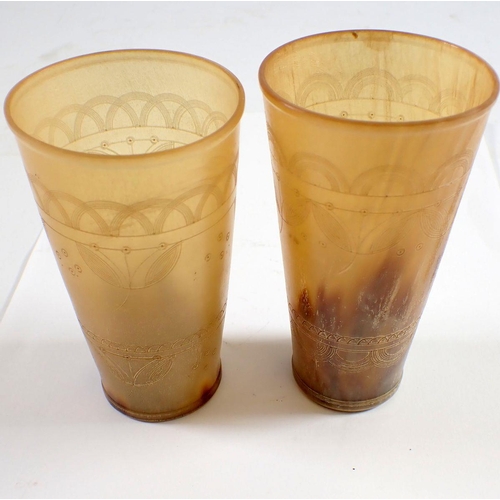 966 - Two engraved horn beakers, 11cm tall