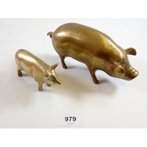 979 - Two brass pigs, largest 18cm