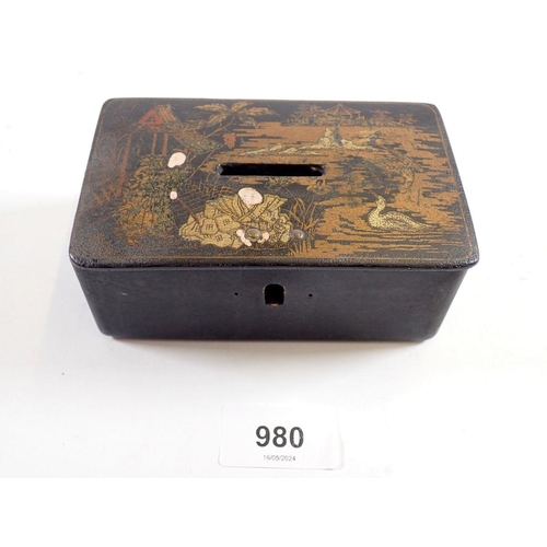 980 - A Japanese lacquer money box decorated figures and landscape, 12.5cm wide