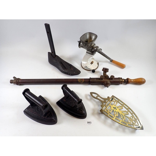 993 - A cast iron shoe last, garden spray, two irons (including Salter Staffordshire knot) and a mincer