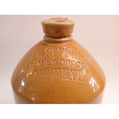 1110 - A stoneware flagon for E A Stephens family Grocer, Newent