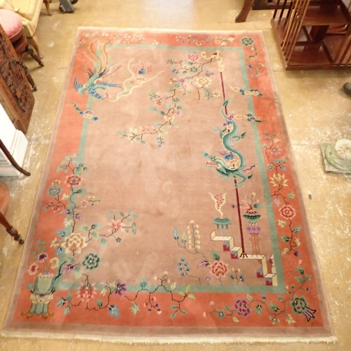 1404 - A Chinese large rug with dragons and flowers on dusty pink ground, 266 x 184cm