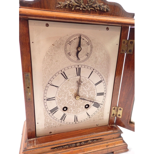 890 - A late 19th century oak mantel clock with German movement marked Lenzkirch, the silvered face with s... 