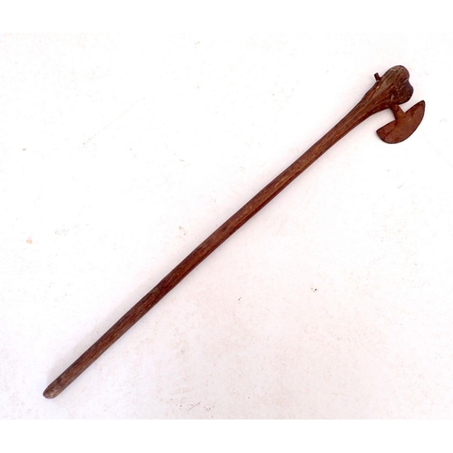 1025 - A tribal axe with wooden handle, 68cm long (Due to recent postal restrictions we can pack bladed ite... 