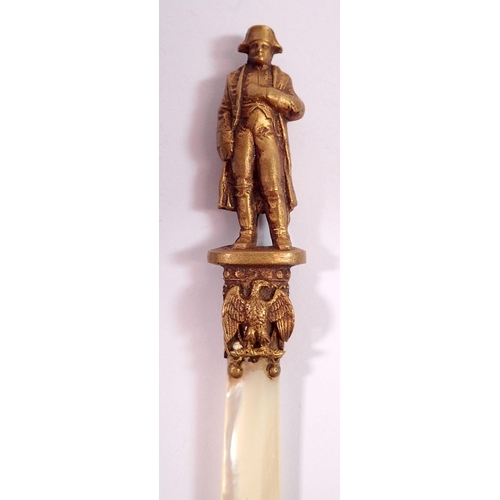 1051 - A 'Napoleon' brass and mother of pearl blade paperknife, 14cm long