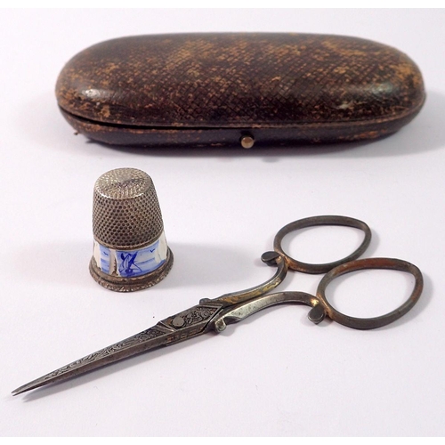 1060 - A 19th century cased pair of needlework scissors and a 900 standard silver and enamel thimble