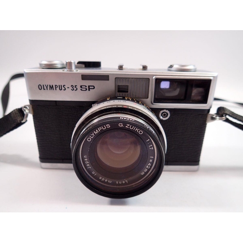 1073 - An Olympus 35-SP camera in case with instructions