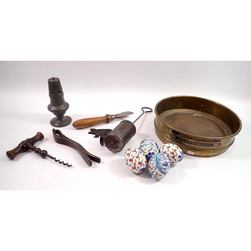 1084 - A box of collectables and kitchenalia including brewery sieve, soap saver, corkscrew etc.