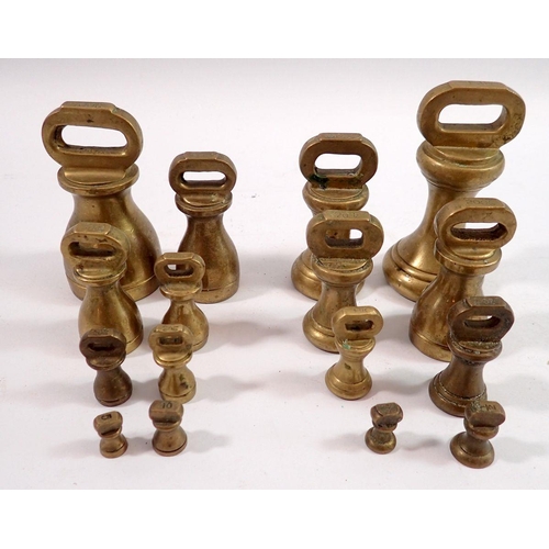 1088 - Two sets of brass graduated weights, one in grams and one in ounces