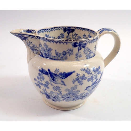 113 - A late 18th century/early 19th century Leeds creamware blue and white jug decorated bird pattern, 19... 