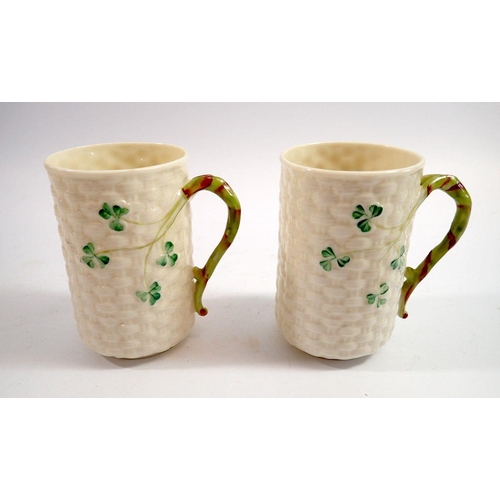 114 - A pair of Belleek Shamrock mugs with green mark, 10cm tall