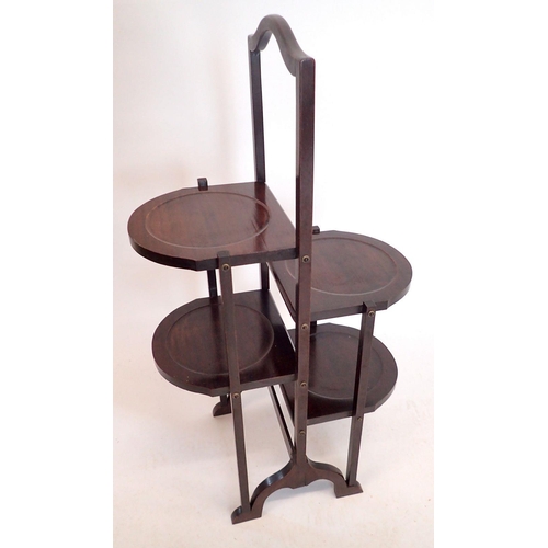 1158 - An early 20th century mahognay double folding cake stand