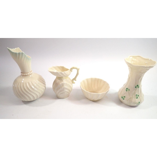 116 - Two Belleek jugs, a Belleek shamrock vase and a Belleek sugar bowl all with gold/brown mark