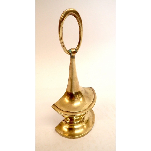 1176 - An early 19th century brass urn form door porter, 29cm