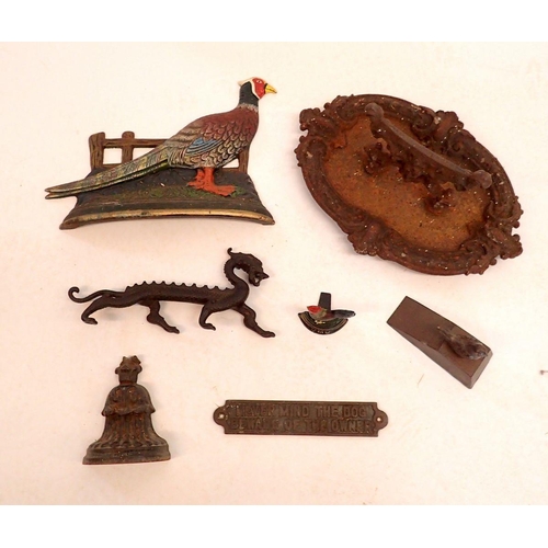 1210 - A Victorian cast iron boot scraper (40cm) together with other cast iron items including pheasant doo... 