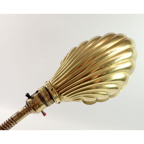 1226 - A brass adjustable table lamp with shell form shade