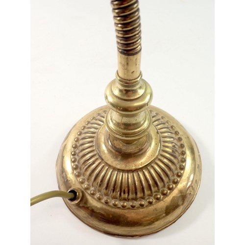 1226 - A brass adjustable table lamp with shell form shade