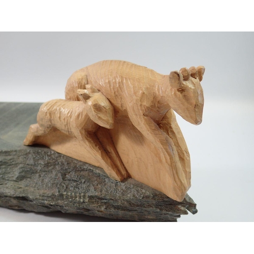 1240 - A large carved wood and stone group of a cheetah chasing an antelope by Dave Johnson (Blaisdon) 71cm... 