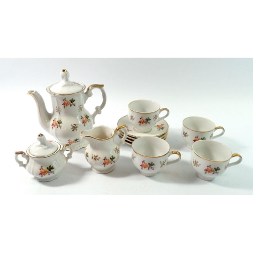129 - A Victorian childs floral painted tea service comprising teapot, four cups and saucers, milk and sug... 