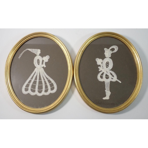 1307 - A pair of lace silhouettes of a knight and maiden in oval frames, figures 22cm tall