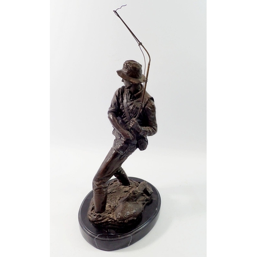 1335 - A bronze finish figure of a fisherman after Milo on marble base, 41cm tall