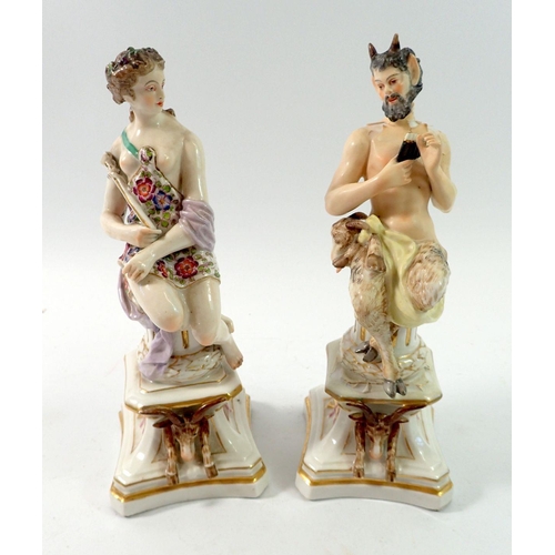 140 - A pair of Naples porcelain figures of Bachus and Venus seated on plinth bases, 20cm - Bachus restore... 