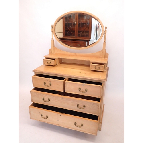 1423 - An Edwardian pine dressing table with oval mirror, 103cm wide