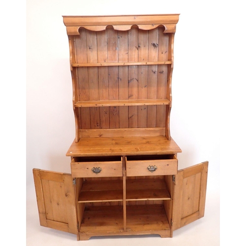 1431 - A small pine dresser with two drawers over cupboard, 91cm wide, 189cm tall