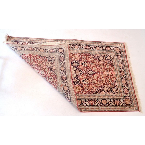 1436 - A Persian style rug with floral medallion in blue, red and cream 155x91cm