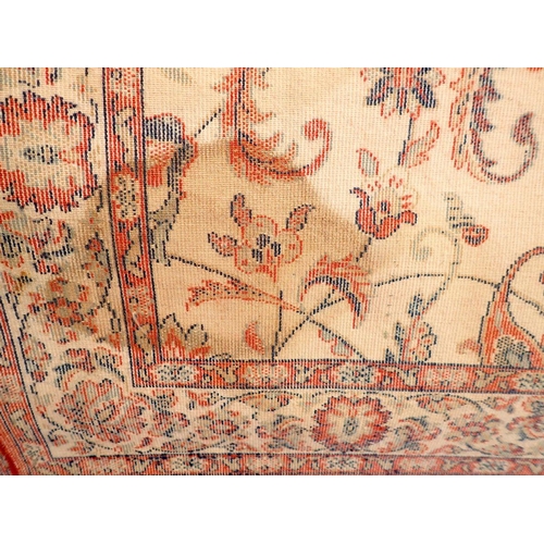 1437 - A small Persian style rug with all over floral decoration on a cream ground 152x80cm