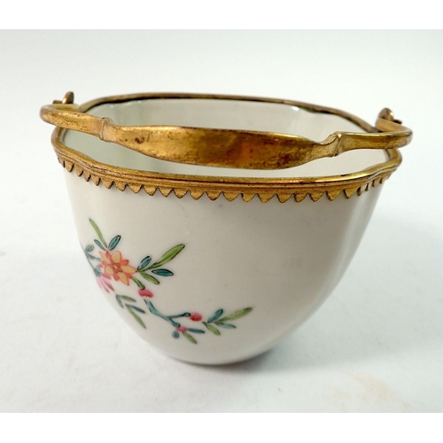 156 - A late 18th century Japanese Kakiemon bowl with European gilded metal mounts and handle, 8.5cm wide