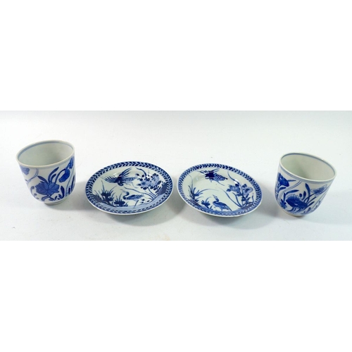 161 - A pair of 18th century Chinese Kangxi period blue and white wine cups painted lotus flowers, sold wi... 