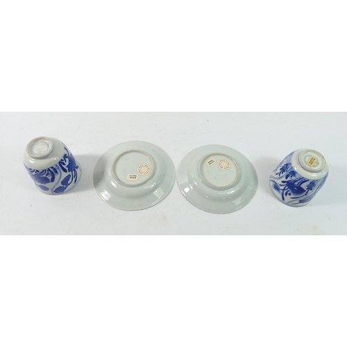 161 - A pair of 18th century Chinese Kangxi period blue and white wine cups painted lotus flowers, sold wi... 