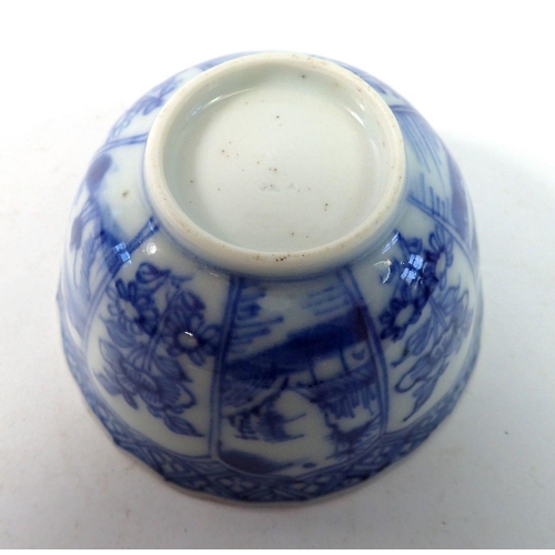 162 - An 18th century Chinese blue and white tea bowl with panelled floral and landscape decoration